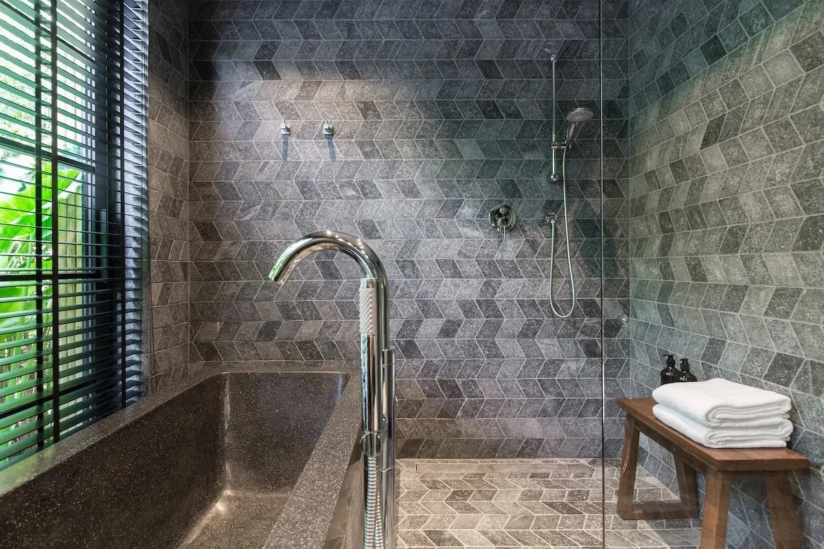 Stone bathtub and walk-in shower